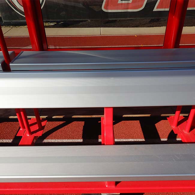 Model #AB20SBUILTIN. 20' aluminum bench with top shelf built into player shelter. Close up view.