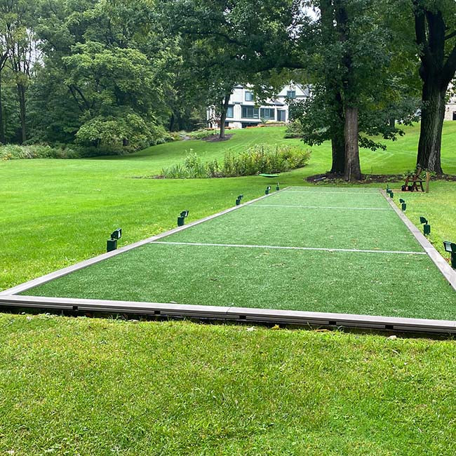 Artificial turf for backyard bocci ball.