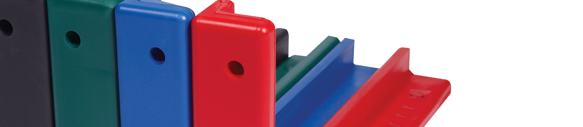 Close-up of five plastic desk organizers or bookends in black, green, blue, and red, standing upright in a row on a white background. Each has a circular hole near the top.