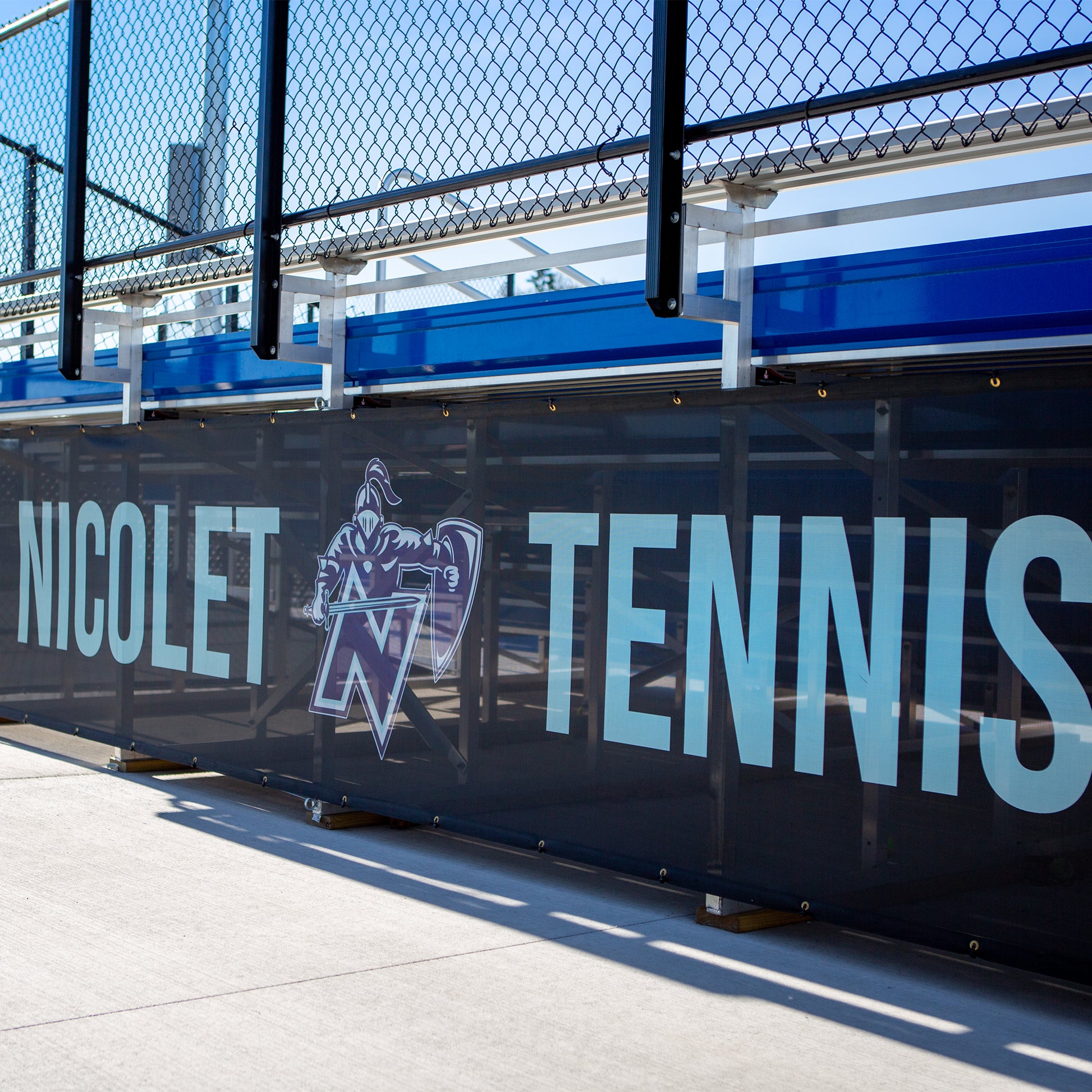 Custom bleacher wrap for Nicolet High School tennis facility.