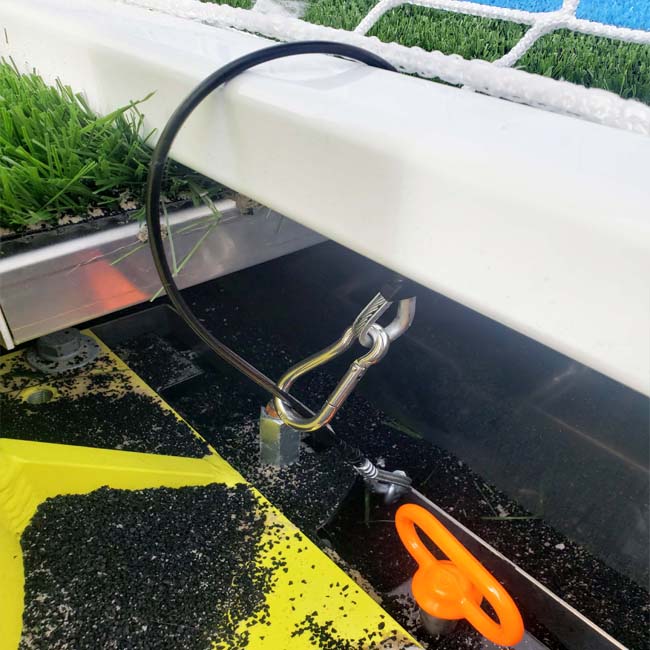 Cable system with access panel to anchor goals.