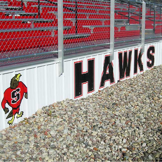 Custom elevated bleachers with 4 foot skirt with high school logo.