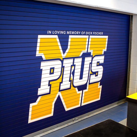 Custom vinyl wrap concession door blue and gold for Pius High school