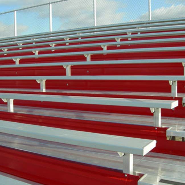 Elevated bleachers with red risers.