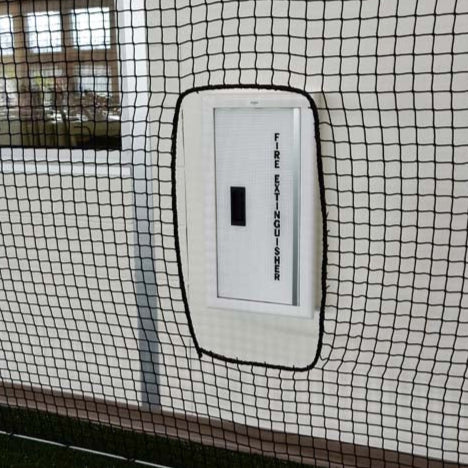 Froedtert Rehab Facility barrier netting cutout for fire extinguisher.