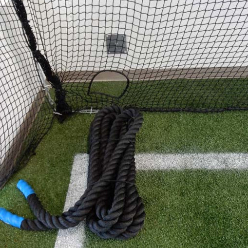 Froedtert Rehab Facility. Protective netting for athletic facility with cutout for ropes.