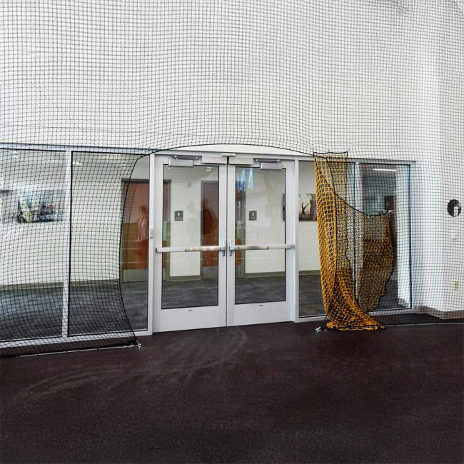 Froedtert Rehab Facility protective netting with doorway opening.