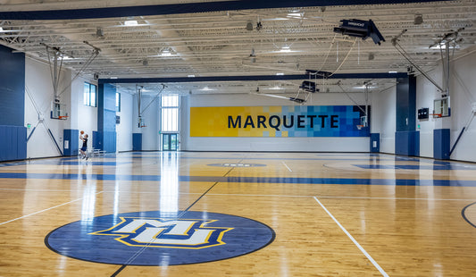 Custom padding, ceiling-hung retractable basketball and volleyball systems, and motorized dividers to maximize safety and flexibility.