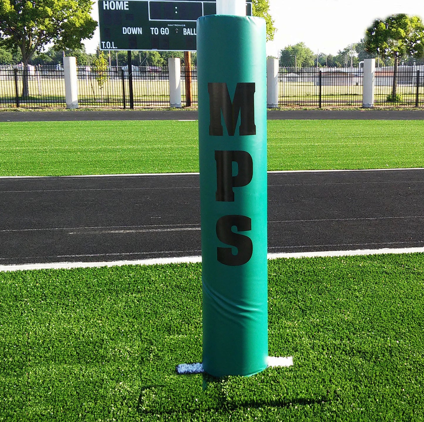 Custom padding for football post. Green with logo in black.