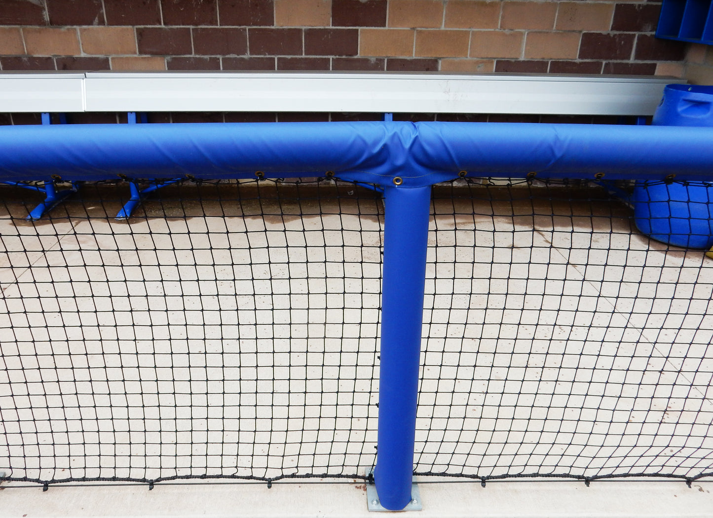 Blue padding for baseball dugout rails.
