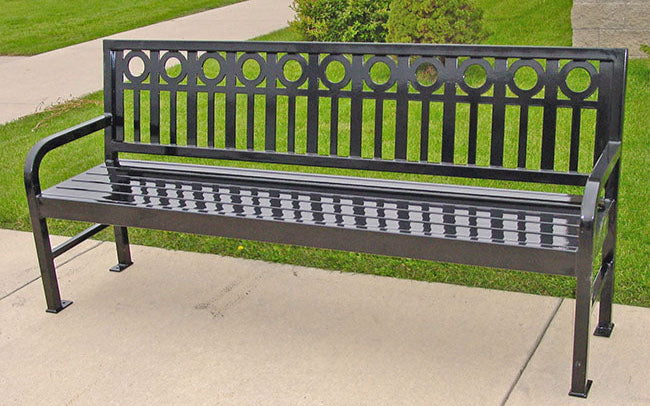 Model #PRASPEN74. Metal outdoor bench in gray for city streets and parks.