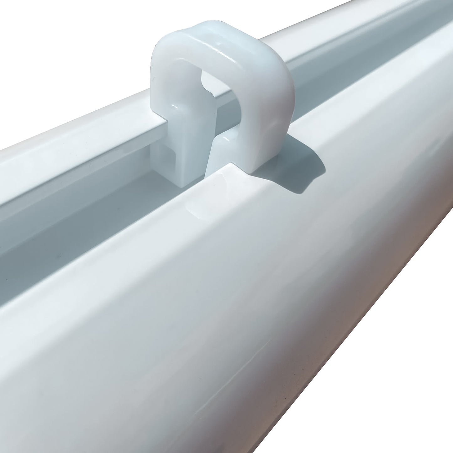 Close-up of a Channel Net Attachment Clip - U Shaped, white plastic, secured to a rectangular track—ideal for attaching nets to aluminum tubing. Shown at an angle on a plain white background.