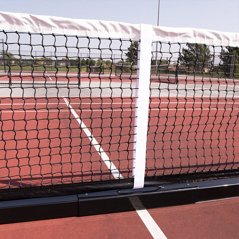 Center of quickstart portable pickleball net on pickleball court.