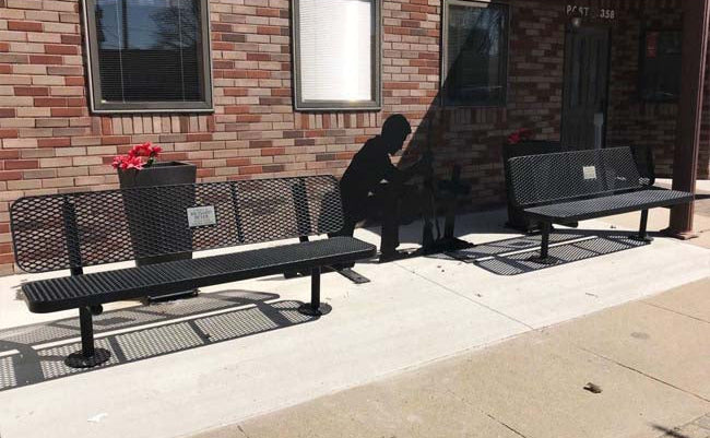 Model #PPS9363M7O99. Champion memorial bench. 6 foot, black, expanded metal, surface mount.