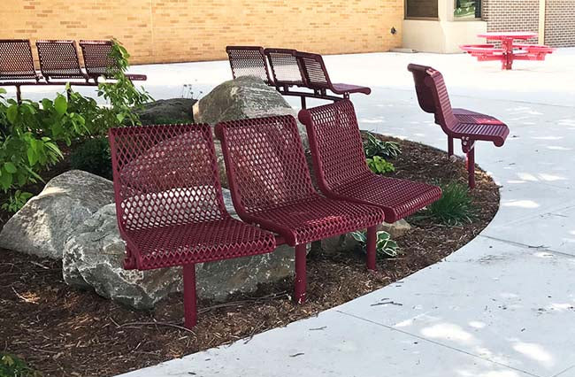 Model #PPS93845D2XAB. Grand Contour 45 degree 3 seat park benches with backrests. Burgundy, expanded metal, direct bury.