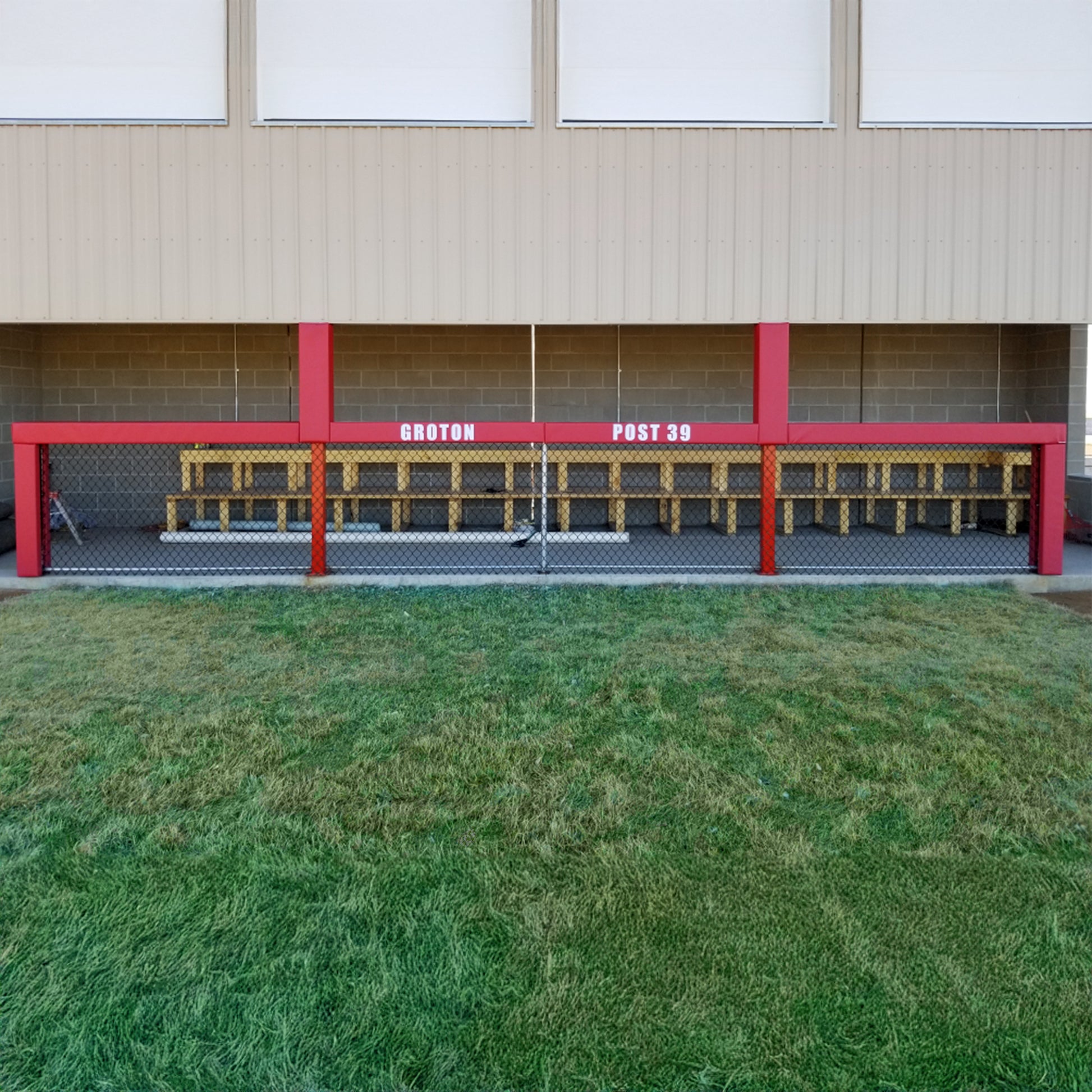 Red dugout rail pad kit with custom lettering.