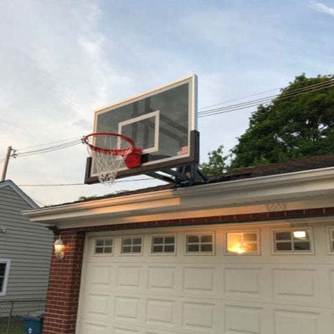 Roofmaster roof mount basketball hoop on grage roof.