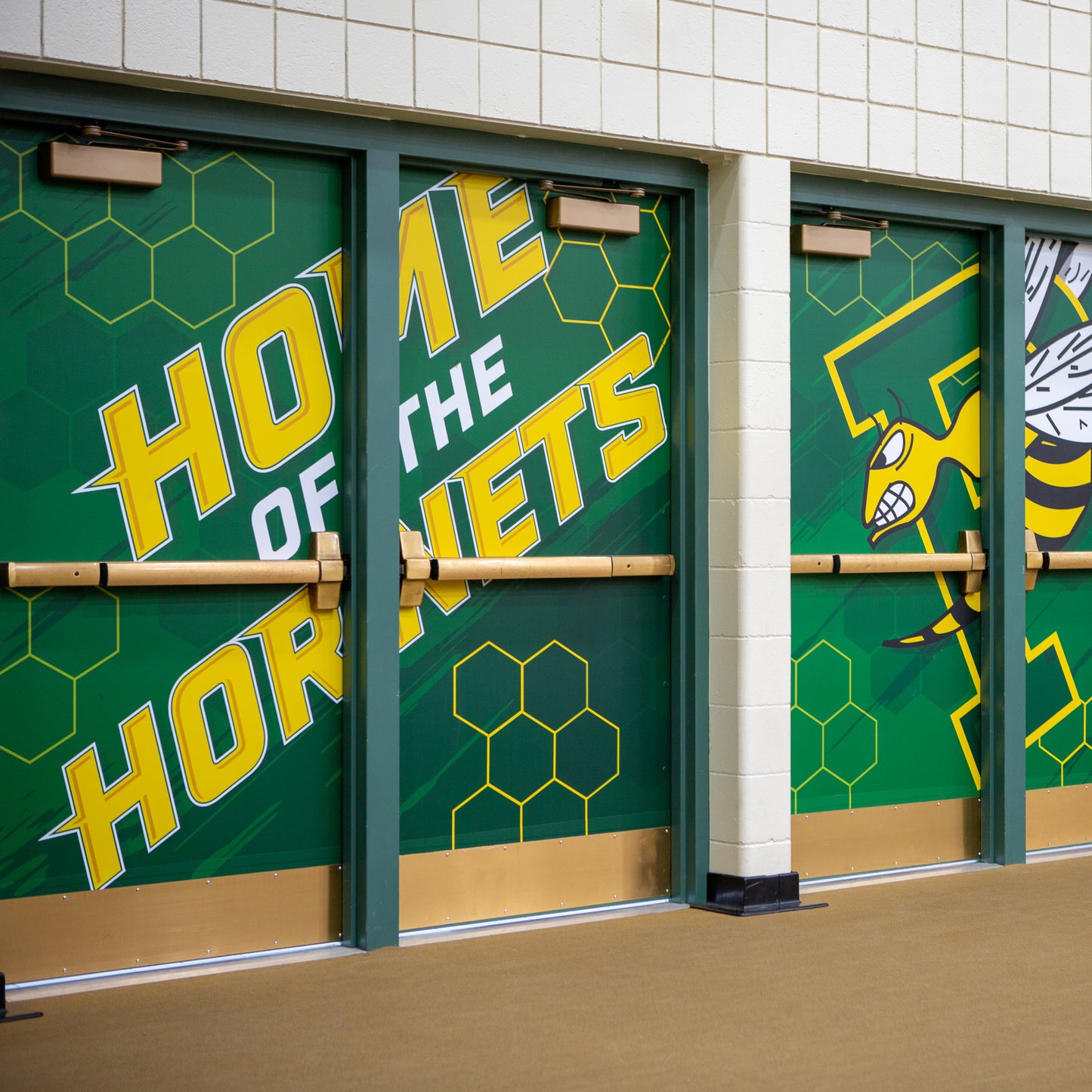 Custom vinyl wrap design on gym doors.