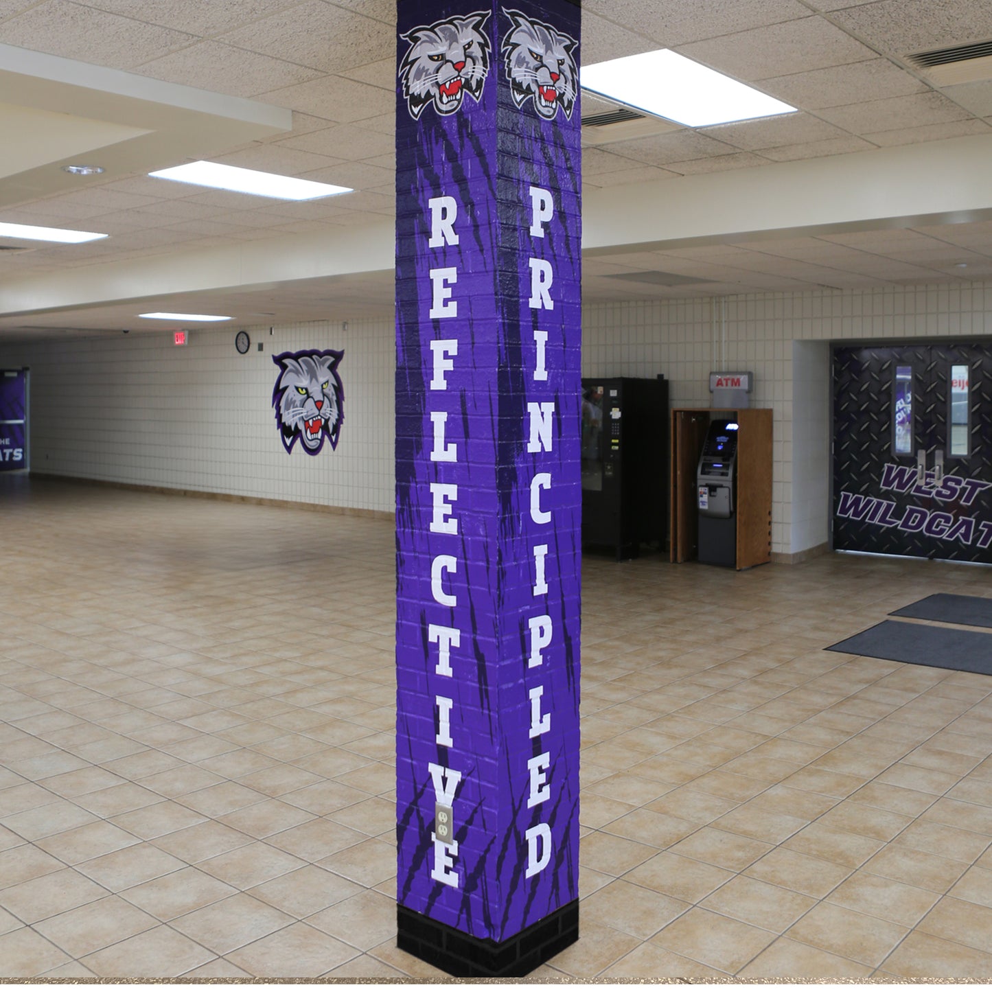 Custom pillar wrap with school logo and value words.