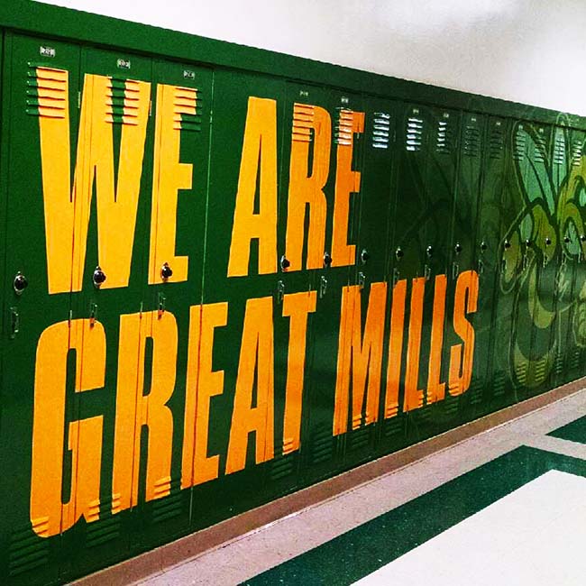 School Branding. Locker wraps with green and yellow graphics with logo.