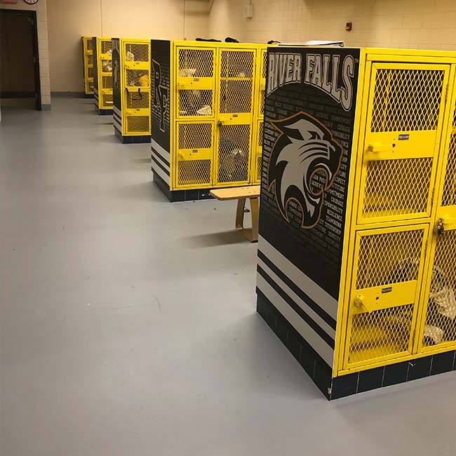 Locker room locker end caps with black and white graphics.