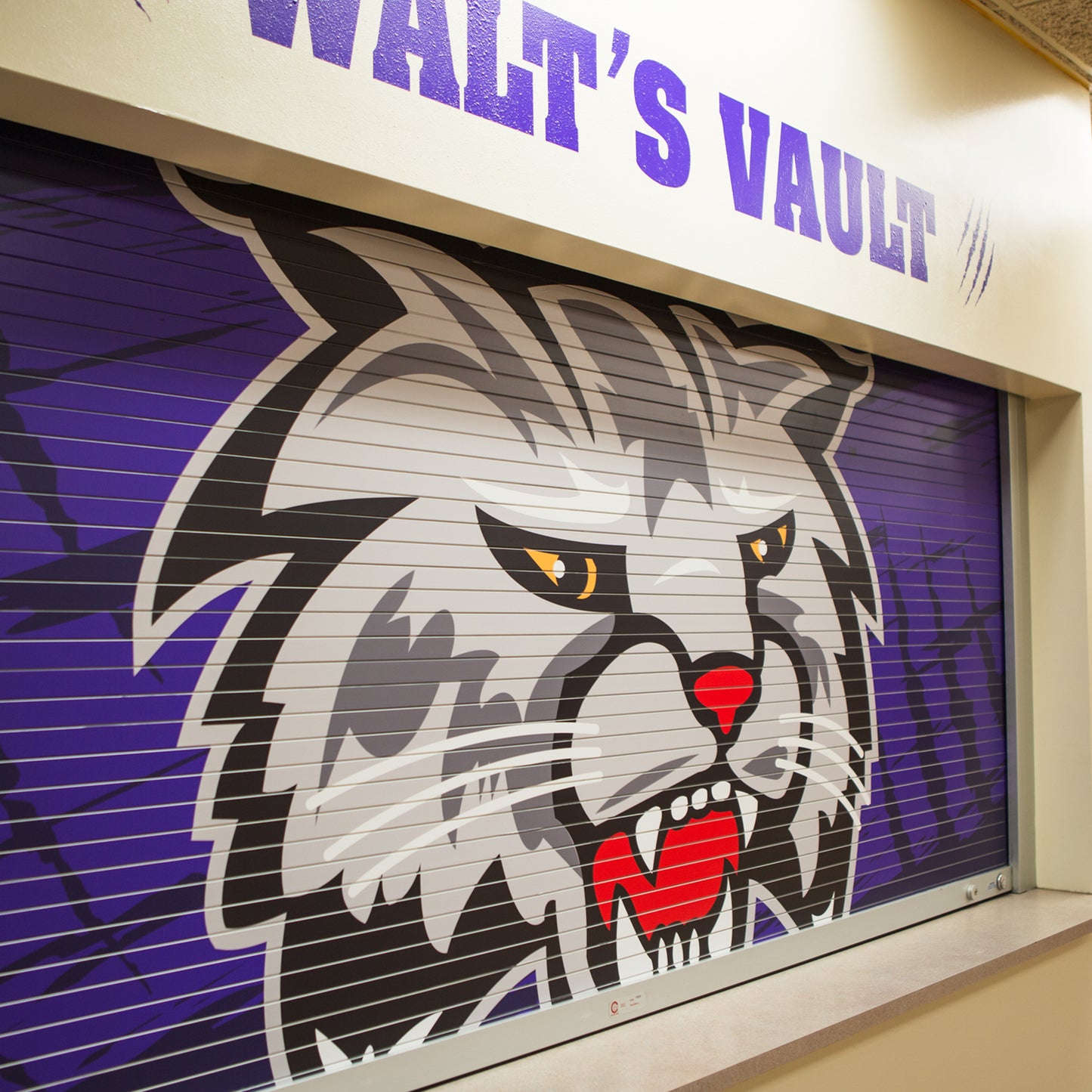 School branding custom roll up concession doors.
