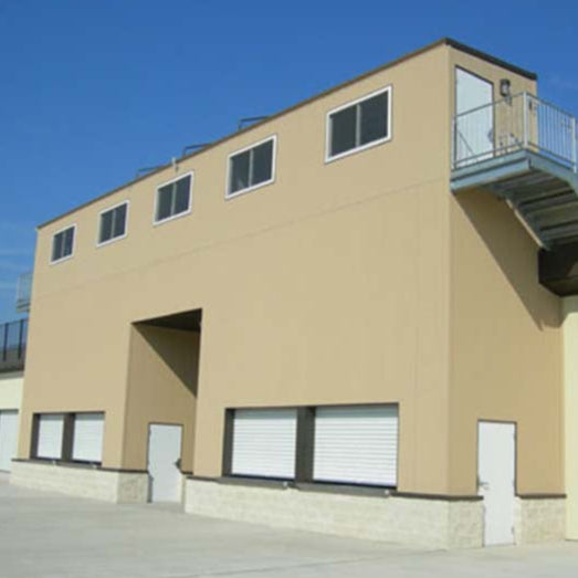 Water tight storage enclosure under bleachers.