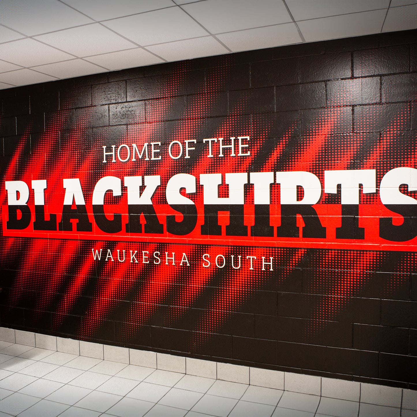 Custom vinyl wall wraps for high school gym.