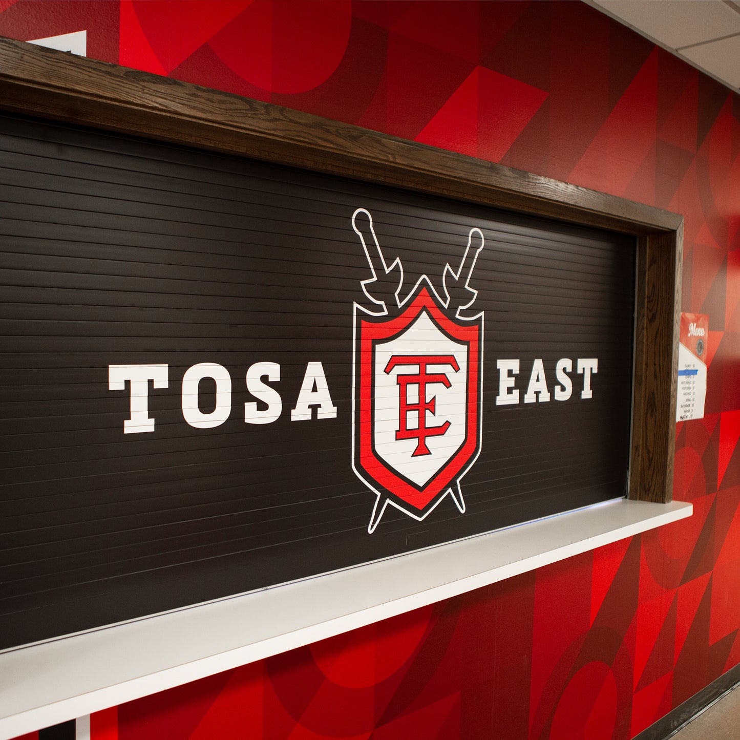 Concession roll up garage door for Tosa East school.