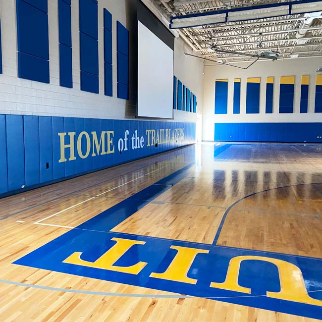 Wall padding with custom logo at Cristo Rey High School.