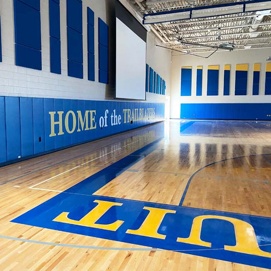 Wall padding with custom logo at Cristo Rey High School.