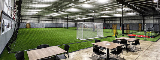 Completed indoor sports facility at Fieldhouse 262 featuring custom sports equipment and protective netting in Richfield, Wisconsin.