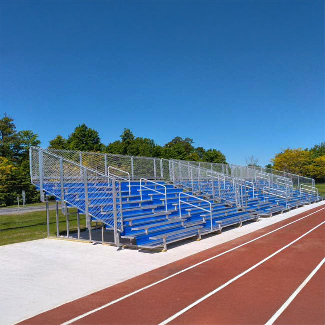 Model #10R25A1GR. 10 row 25'L bleachers with guardrail and royal blue risers.