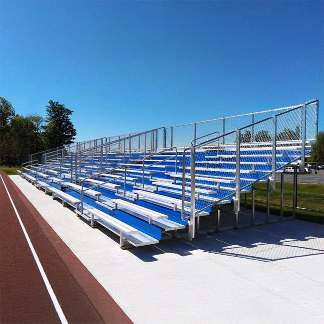 Model #10R25A1GR. 10 row 25'L bleachers with guardrail and royal blue risers.