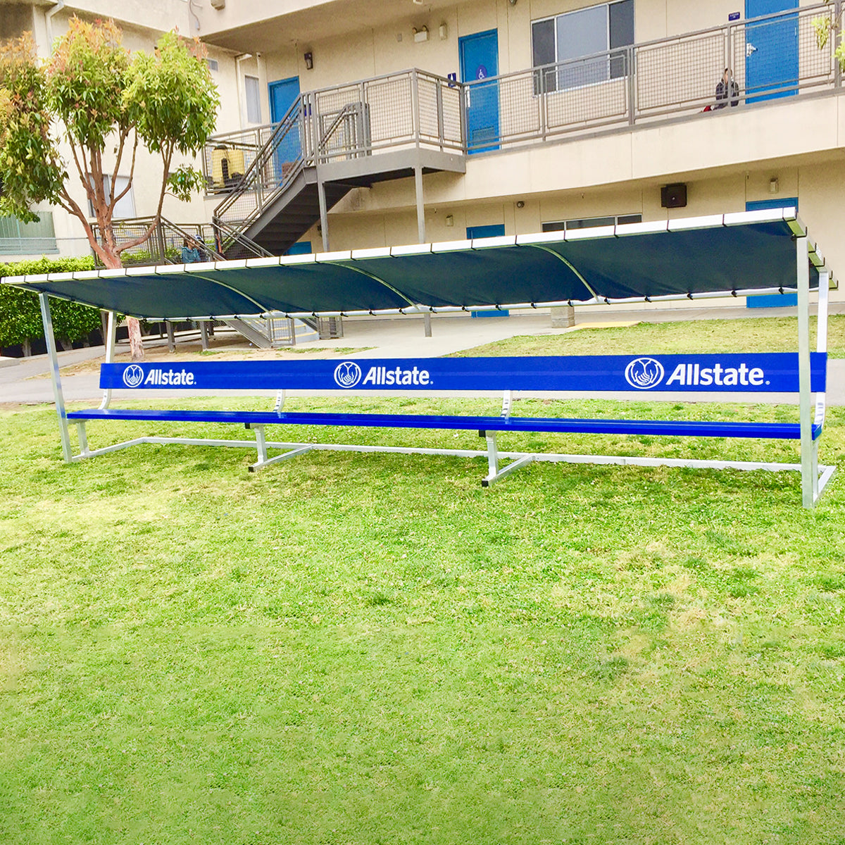 Covered athletic team bench. Custom blue bench with All-State logo.