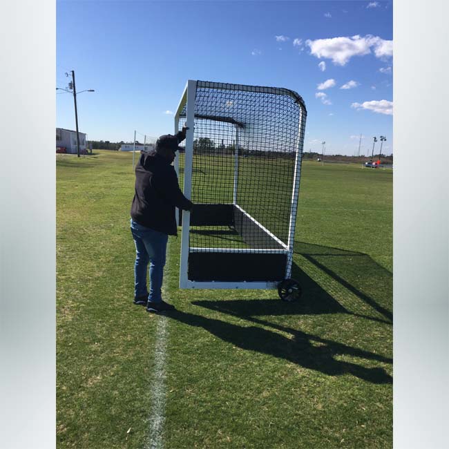 Model #FJG32AL. Pro field hockey goal being moved.