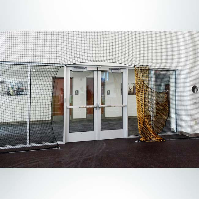 Froedtert Rehab Facility protective netting with doorway opening.