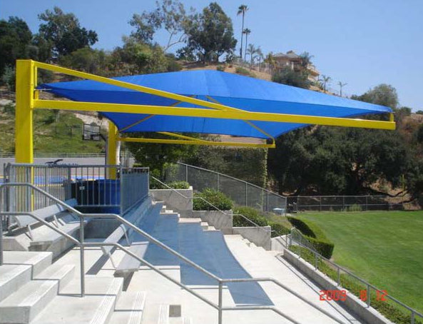 Model #RCPFSCH2030-08. 20'x30' Fabric cantilever shade for bleachers.