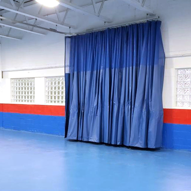Gym divider curtain with Besteel track.