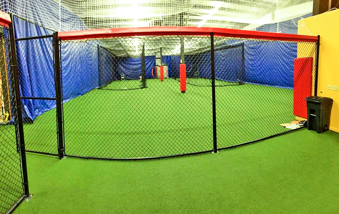 Padding for batting cages at indoor baseball facility.