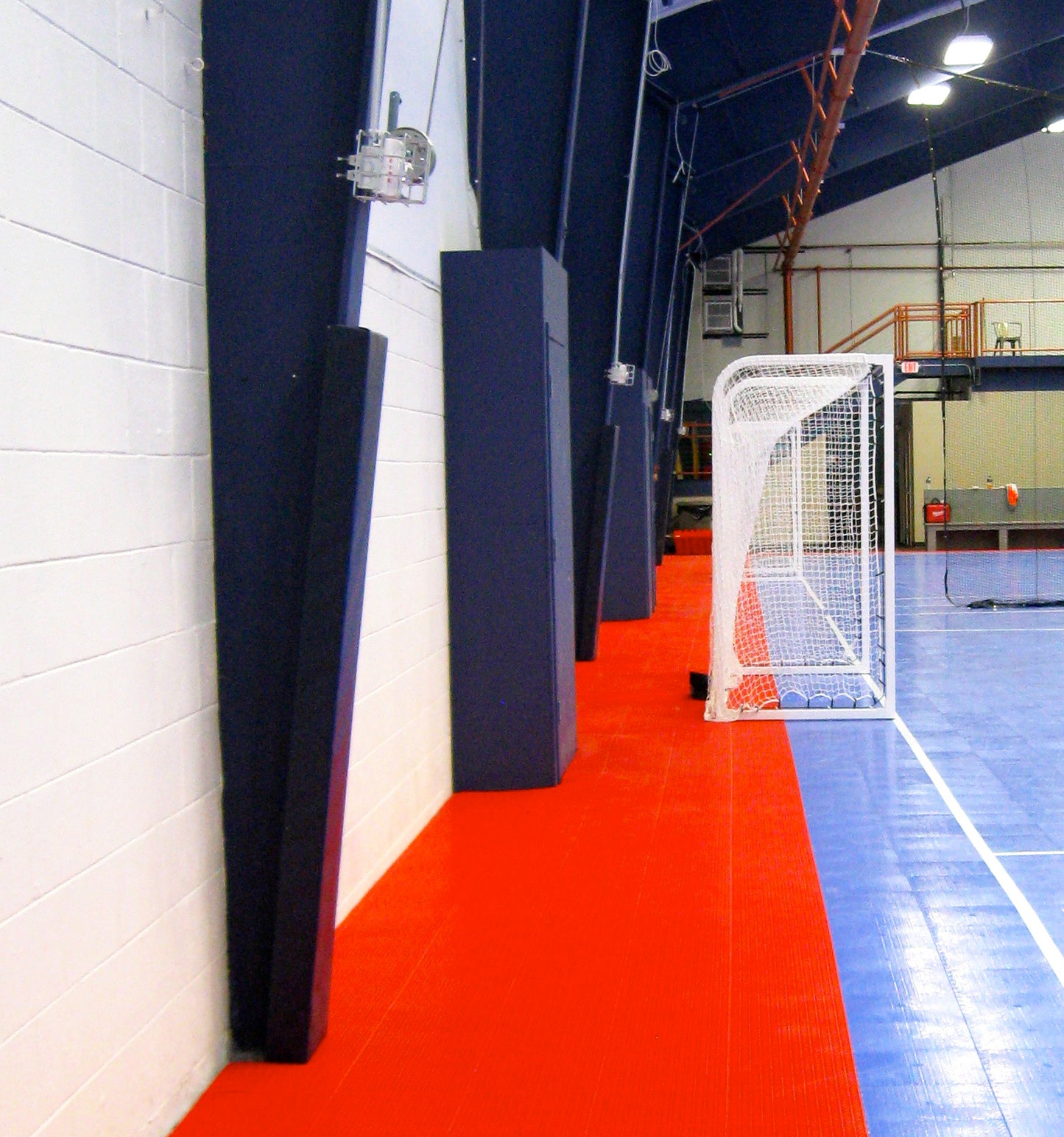 Custom post padding for futsal and volleyball courts.