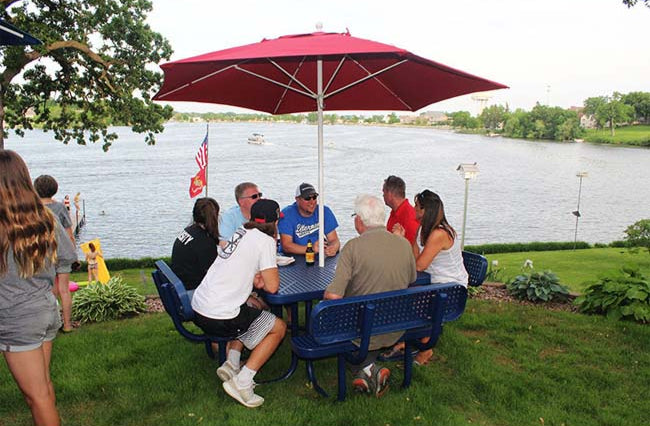 Model #PPS922101O22A. Champion square four seat picnic table. 4 foot, blue, expanded metal, free standing. Red market umbrella.