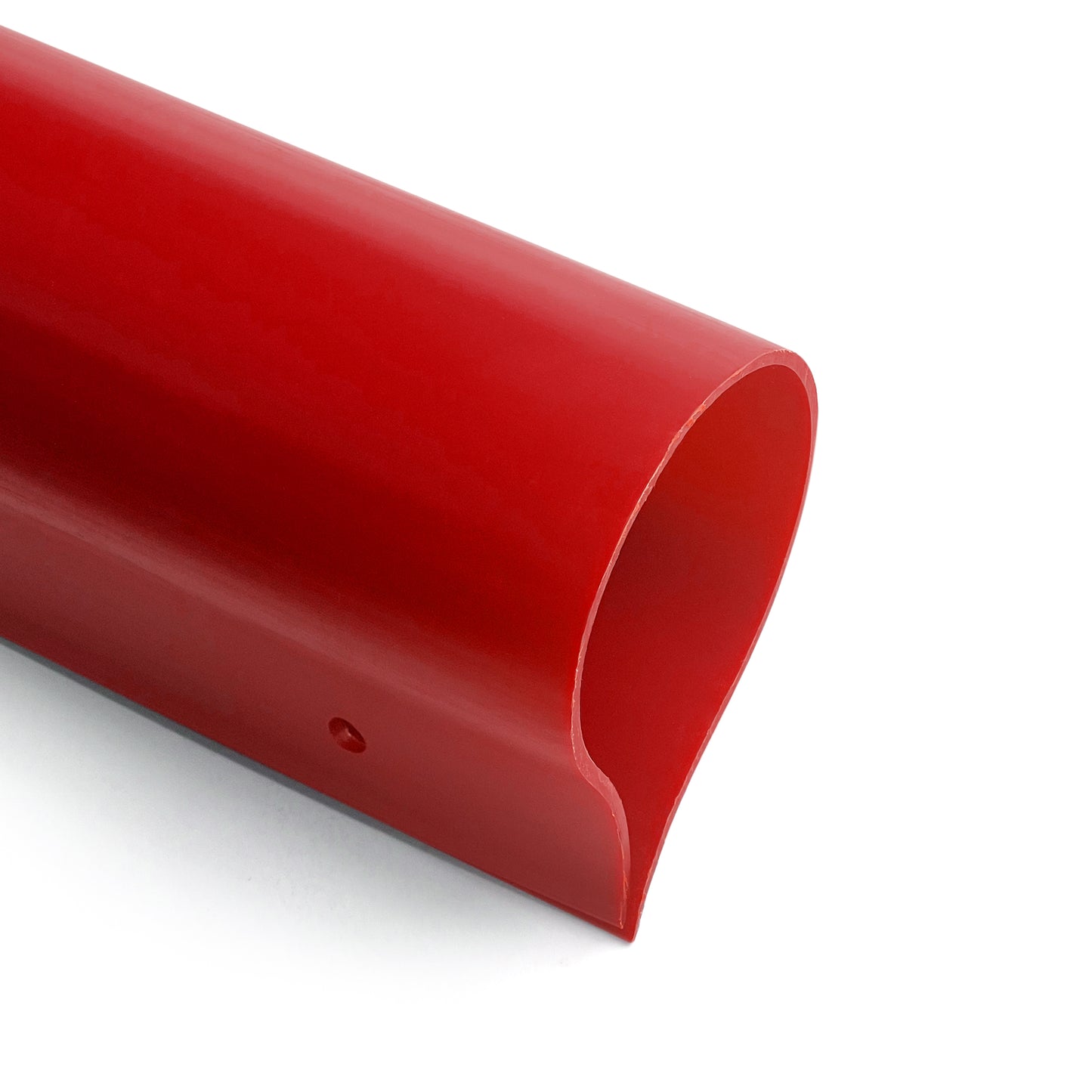 A close-up of the Premium Fence Guard, a smooth, shiny red plastic tube with a curved, partially open end and UV resistance, designed as a fence cap against a white background.