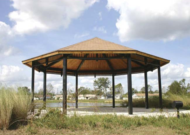 Model #RCPLWOCT29-09. 29' radius laminated wood octagonal park shelter with optional ornamentation.