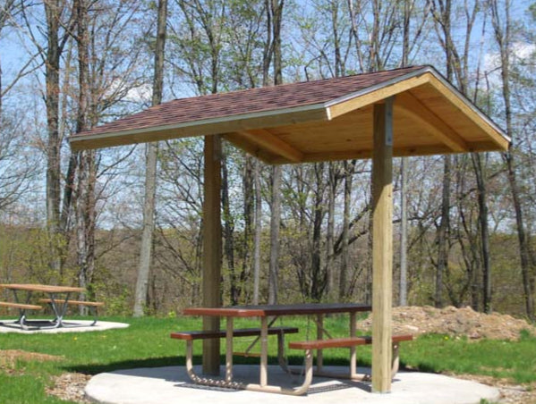 Model #RCPLWG102P-04. 10'x10' laminated wood two post gable park shelter with optional shingle roofing.