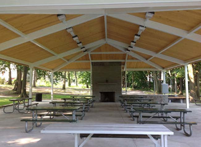 Gable style park shelter to cover picnic tables.
