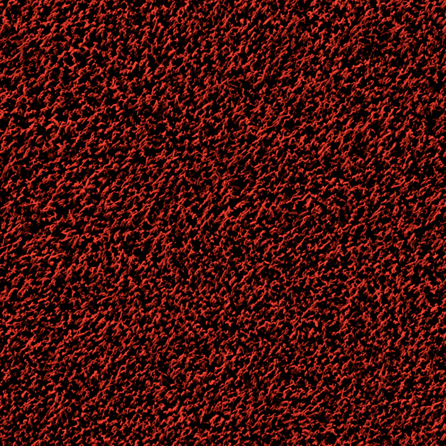 A close-up view of a textured surface with a dense pattern of red and black, creating a rough, almost fuzzy appearance. The interwoven colors add depth and intricate detail, reminiscent of the durable weave found in the Portolite Pitching Mound Protector | 13′ x 4′ Inlaid Pitching Mound Mat designed for turf protection.