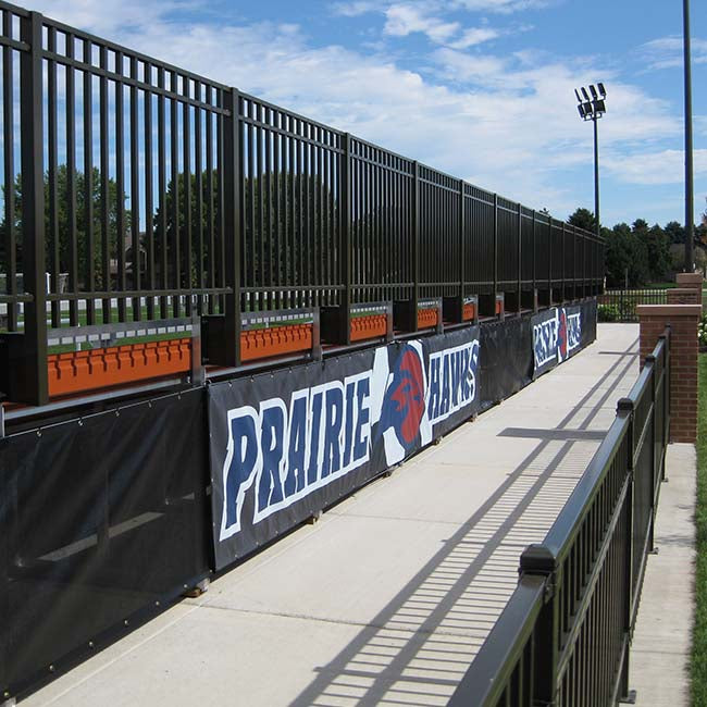 Windscreen with custom logo at athletic field.