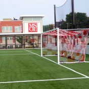 Wheeled Stadium Cup goal with white frame and red and white checkered net.