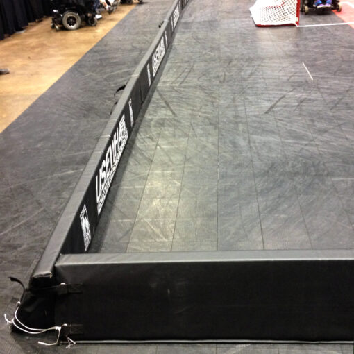 Model #FSP12. Portable boundary padding for wheelchair hockey.